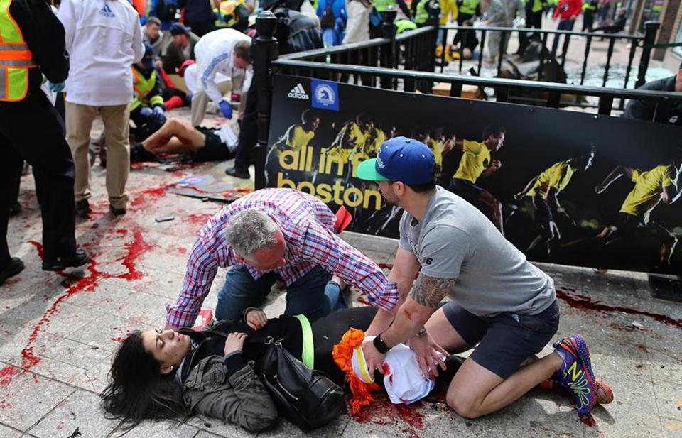 Hero at Boston Marathon bombing who looks to be applying an improvised pressure dressing ... 