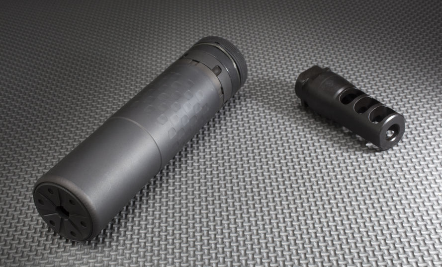 rifle silencer and the mount that holds it on the barrel